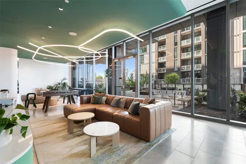 a view of a swimming pool with a yard