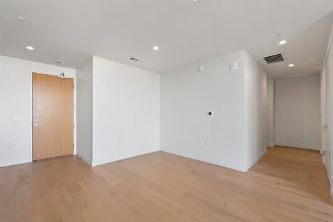 a view of a kitchen with a sink and a refrigerator
