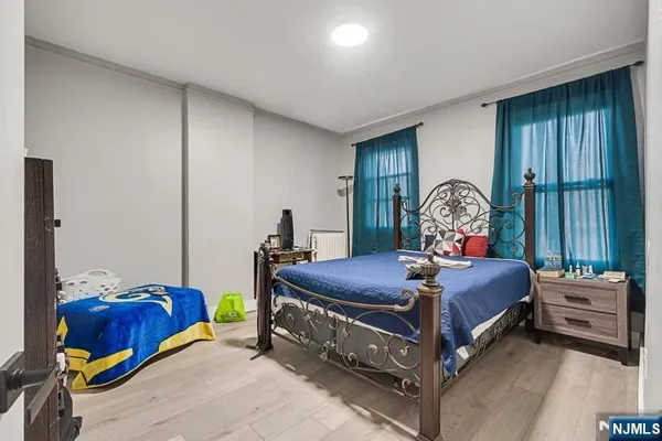 a bed room with a bed and a window