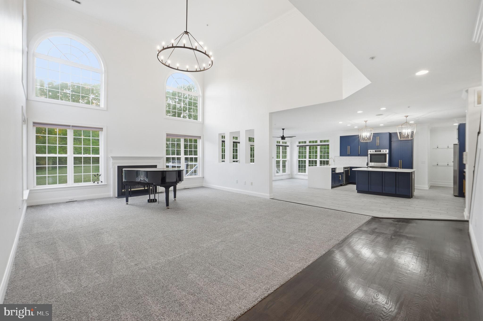 19081 Poplar Ridge Road Brandywine, MD 20613 - Photo 26 of 64 a view of a livingroom with furniture a ceiling fan and windows