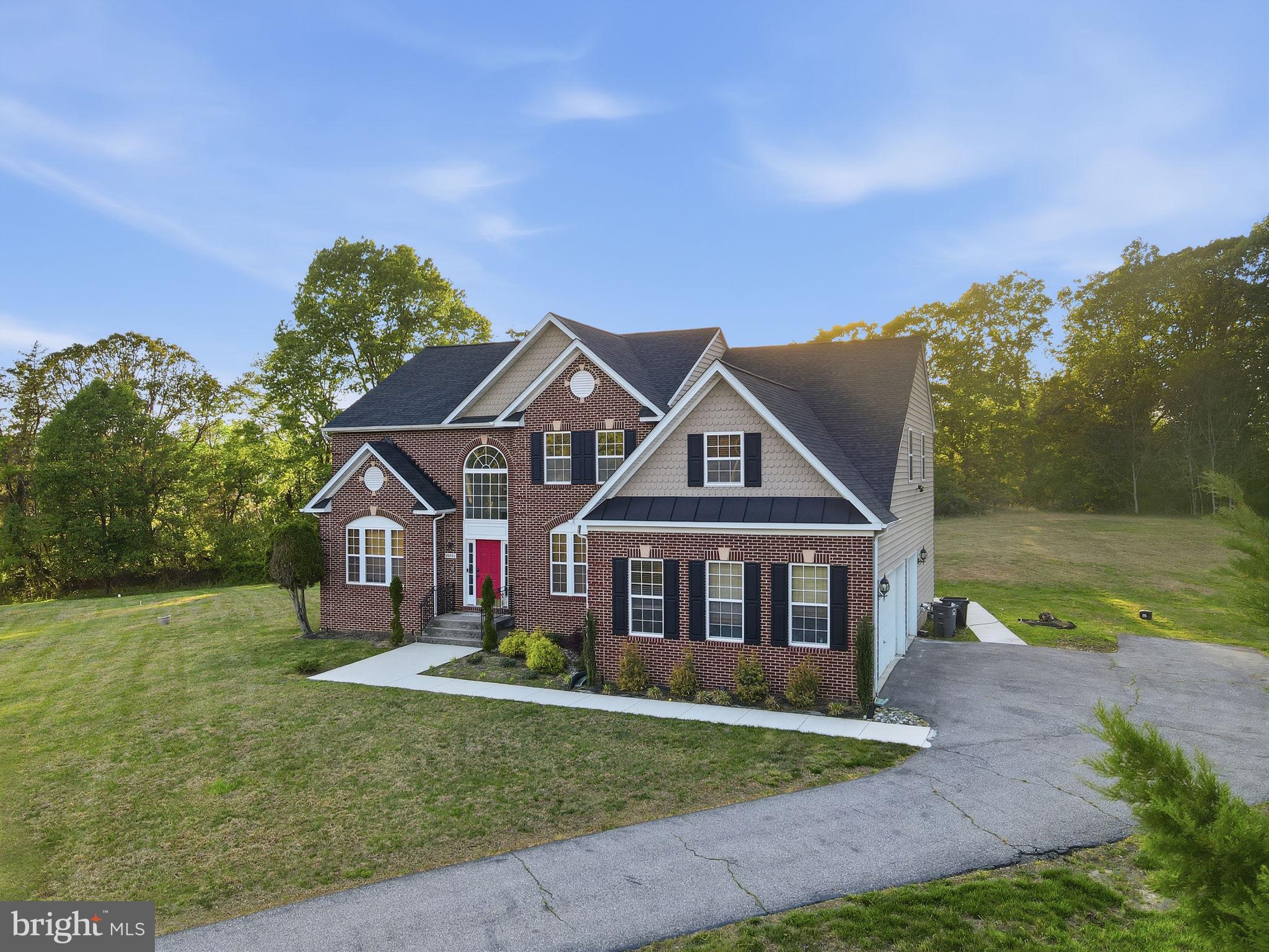 19081 Poplar Ridge Road Brandywine, MD 20613 - Photo 3 of 64 a front view of a house with garden