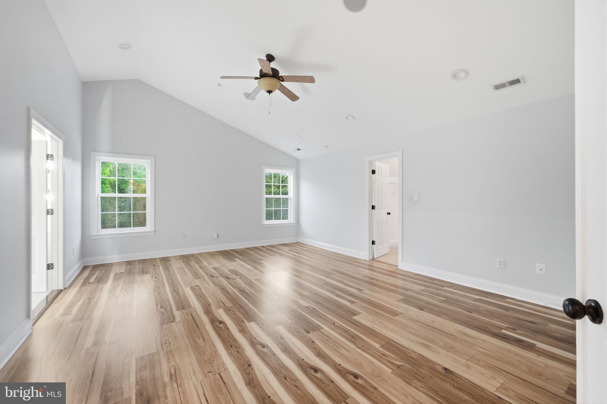 19081 Poplar Ridge Road Brandywine, MD 20613 - Photo 42 of 64 wooden floor in an empty room with a window