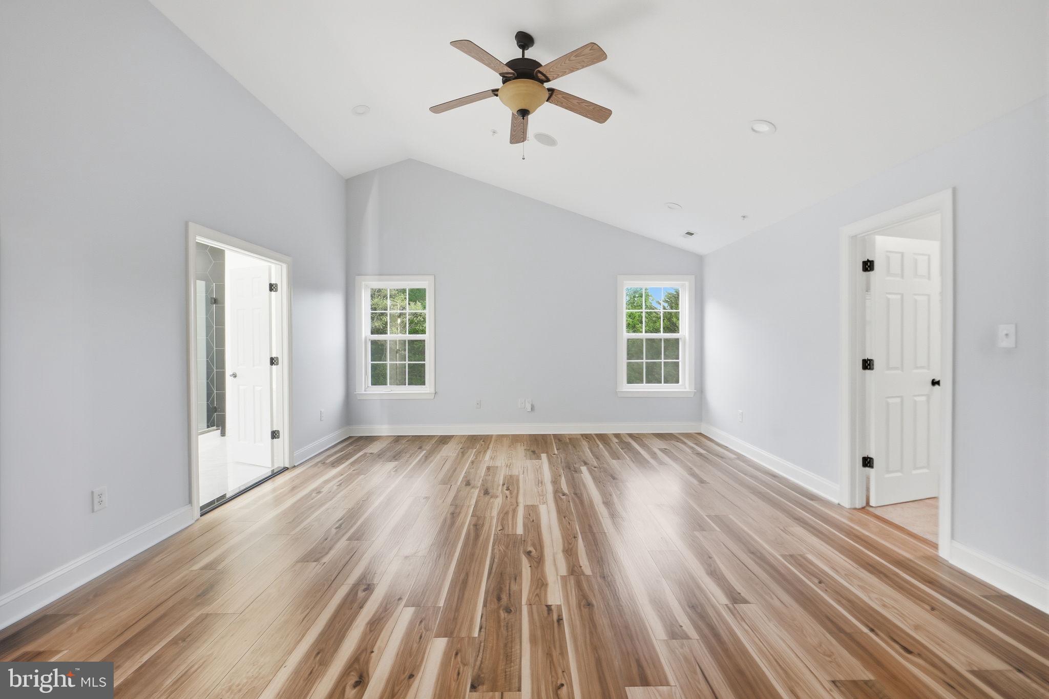 19081 Poplar Ridge Road Brandywine, MD 20613 - Photo 43 of 64 wooden floor in an empty room with a window