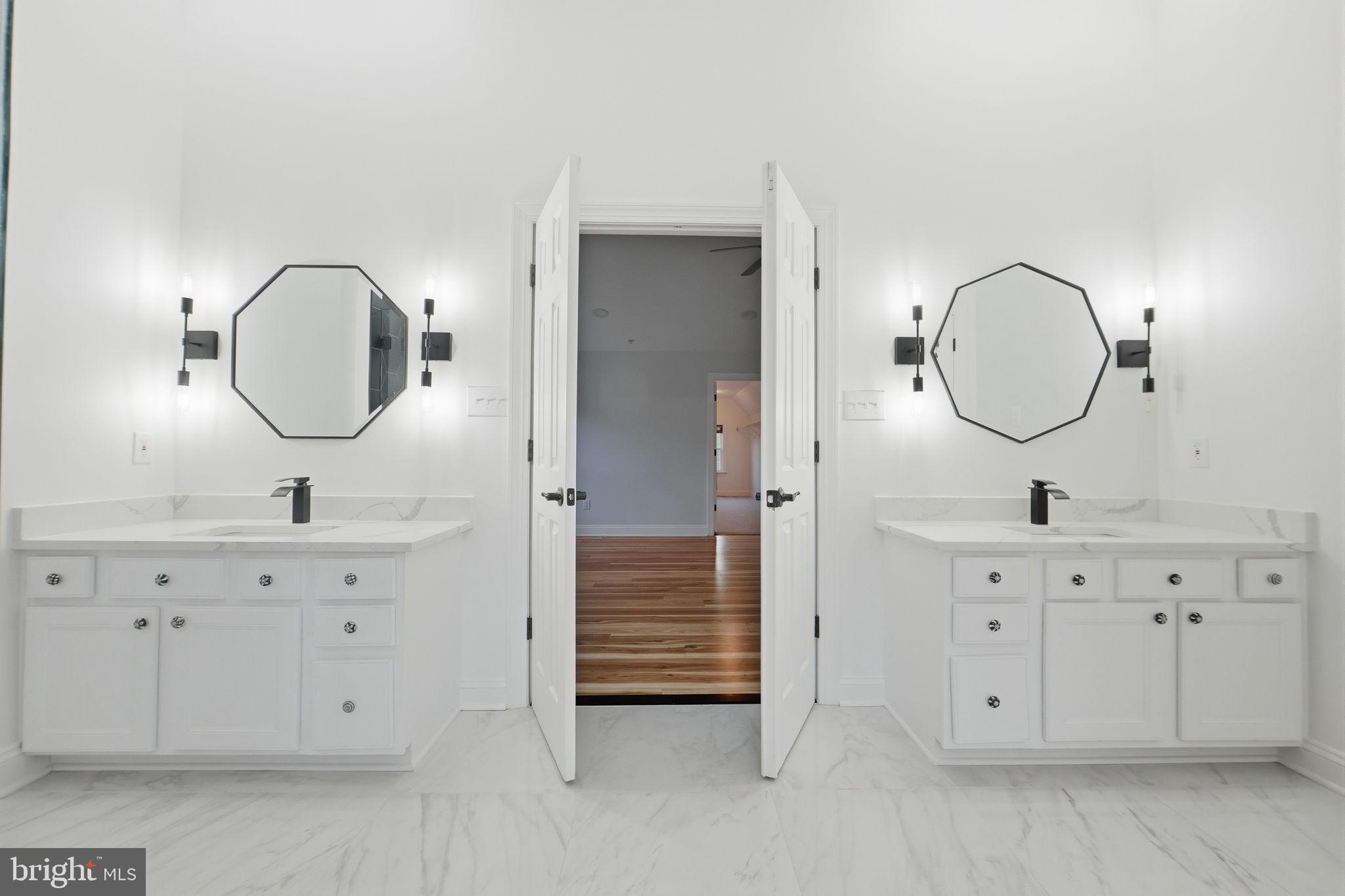 19081 Poplar Ridge Road Brandywine, MD 20613 - Photo 47 of 64 a bathroom with a sink vanity and mirror
