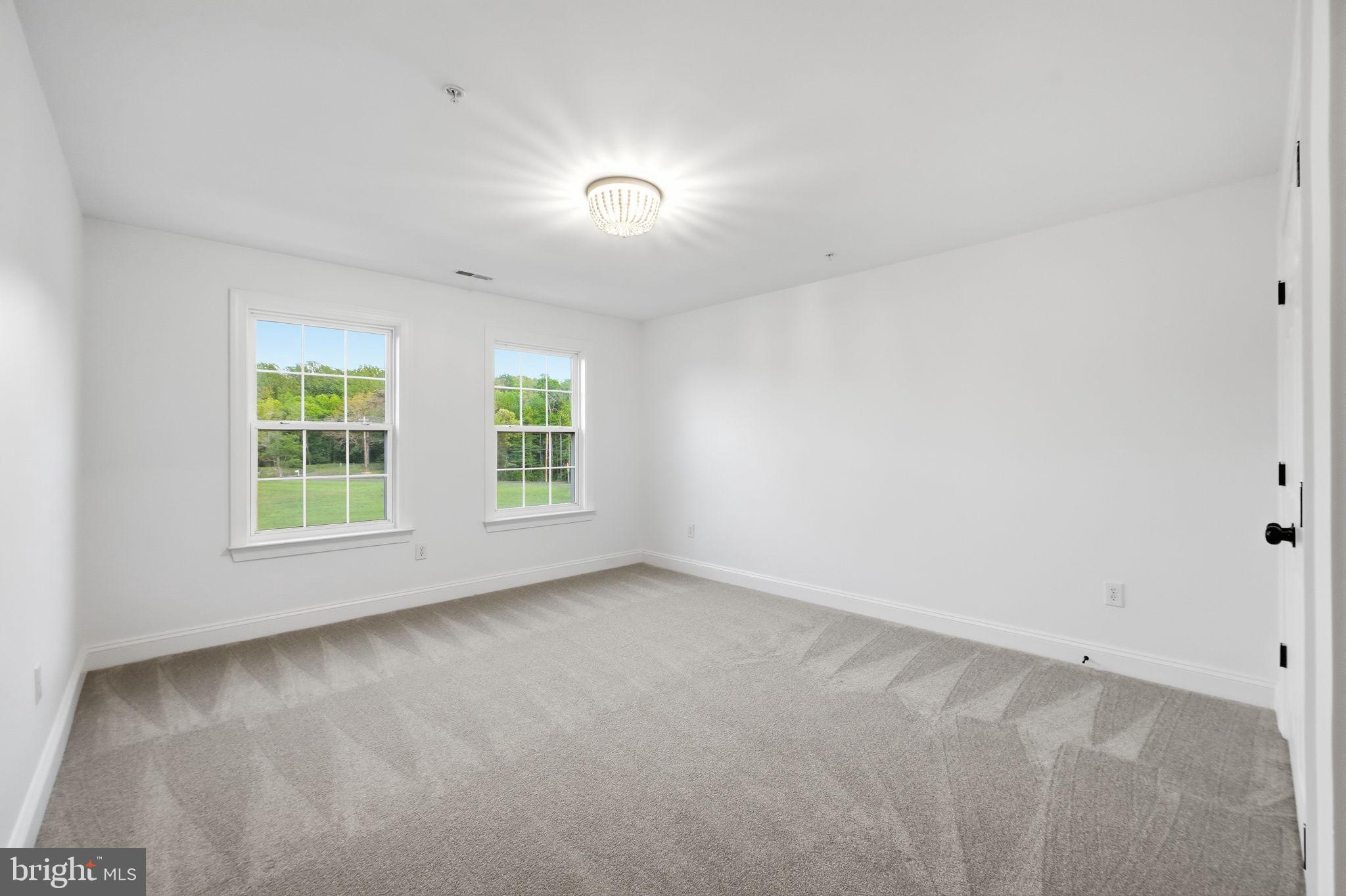 19081 Poplar Ridge Road Brandywine, MD 20613 - Photo 49 of 64 an empty room with windows
