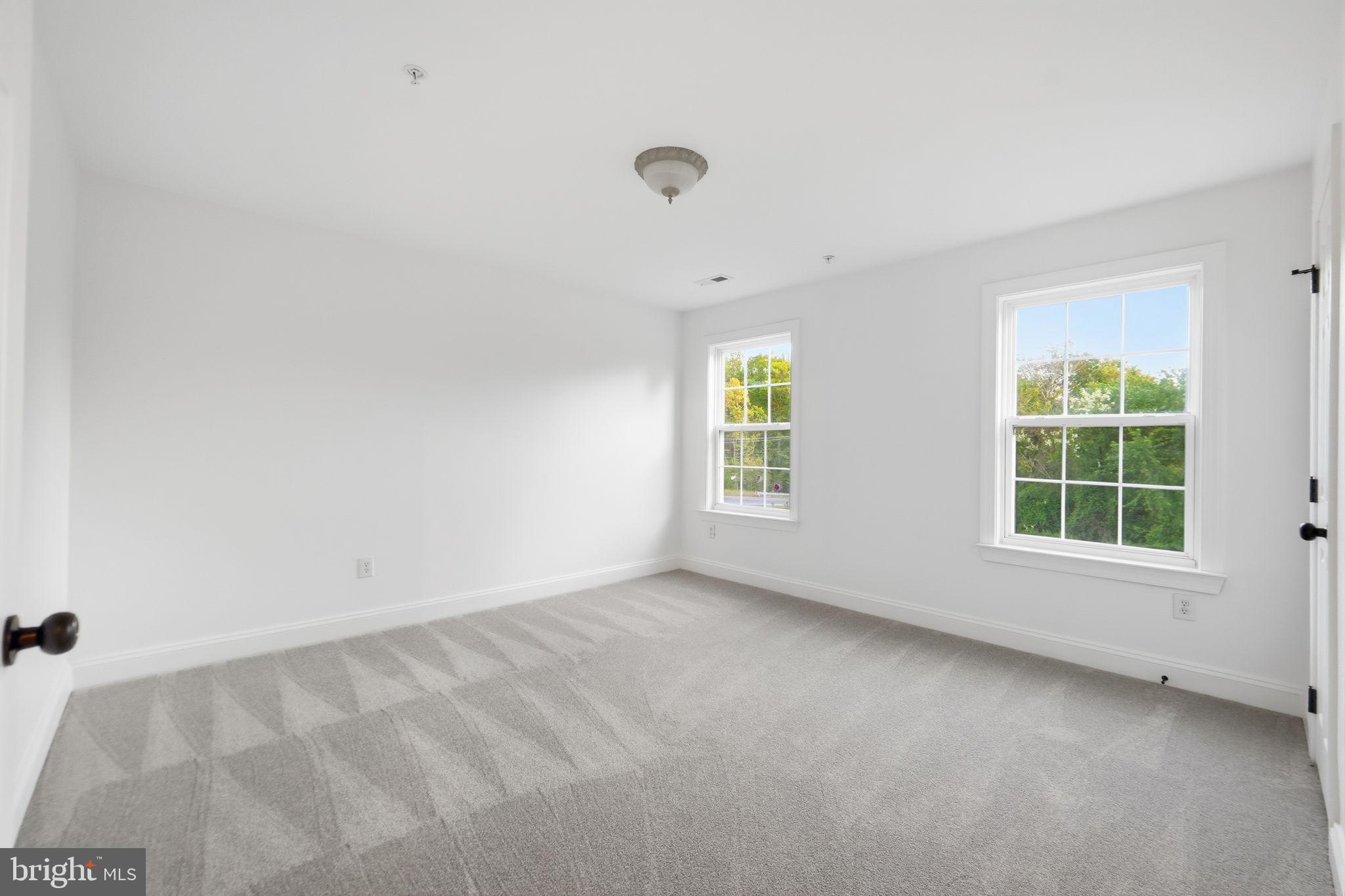19081 Poplar Ridge Road Brandywine, MD 20613 - Photo 54 of 64 an empty room with a window