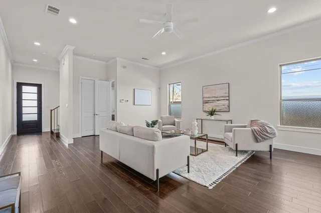 a living room with furniture and a table