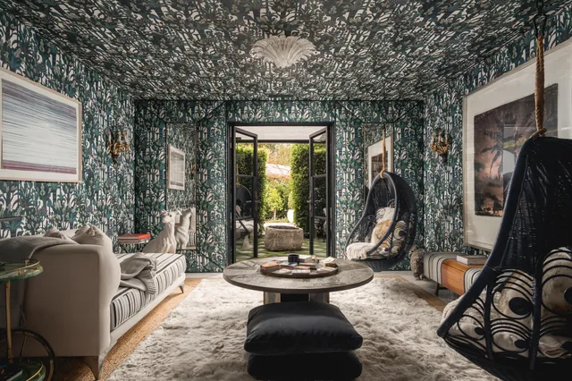 a view of a patio with couches chairs and a potted plant