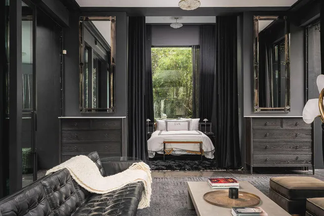 a view of a yard with plants and trees