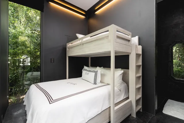 an aerial view of a residential apartment building with parking space