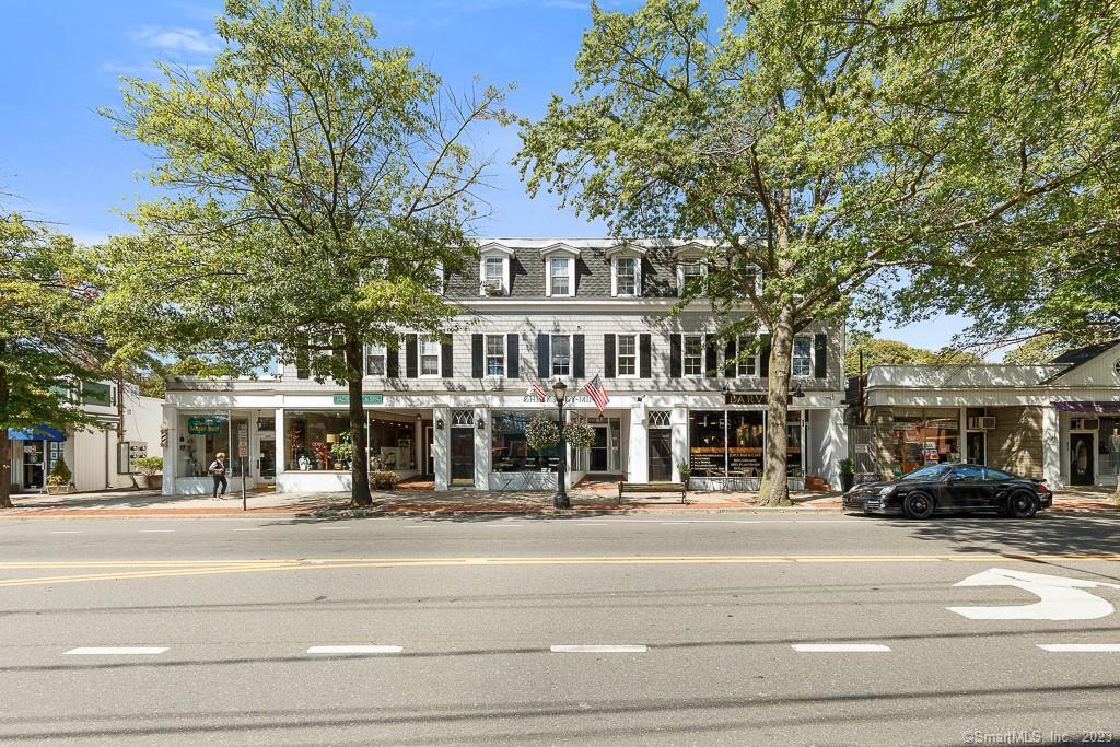 885 Post Road, Unit 2B Darien, CT 06820 - Photo 1 of 1 a view of a building with a street