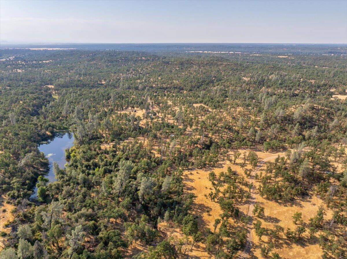 0 Two 2 Feathers Road Cottonwood, CA 96022 - Photo 23 of 41 an aerial view of house with yard and mountain view in back