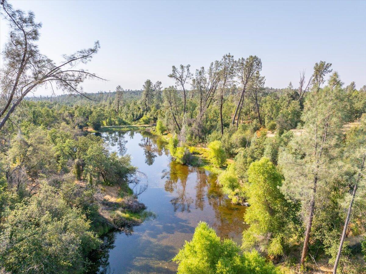 0 Two 2 Feathers Road Cottonwood, CA 96022 - Photo 28 of 41 a view of a lake with a building in the background