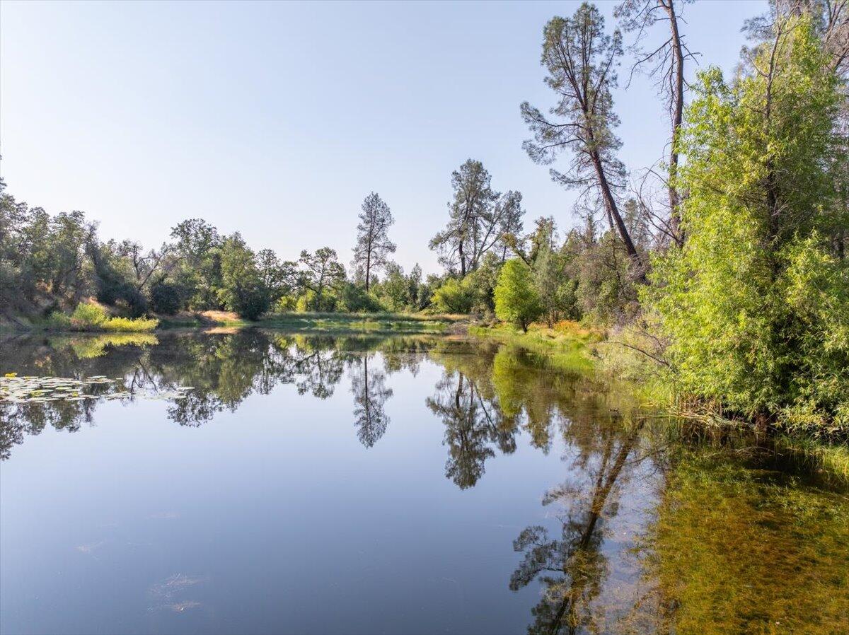 0 Two 2 Feathers Road Cottonwood, CA 96022 - Photo 29 of 41 a view of a lake in between two and trees