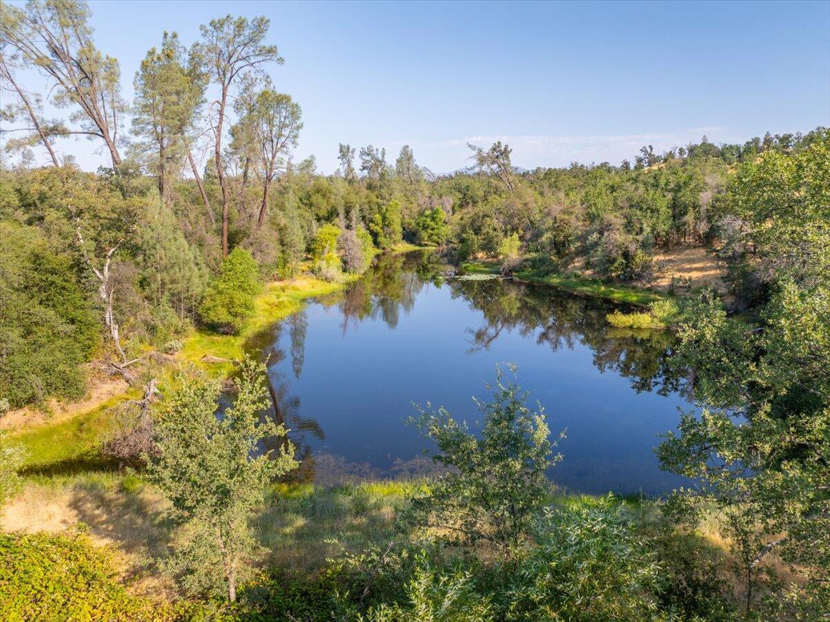 0 Two 2 Feathers Road Cottonwood, CA 96022 - Photo 4 of 41 a view of a lake with a mountain in the background