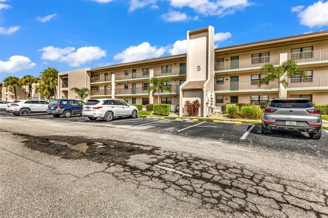 a view of a parked cars in front of a building