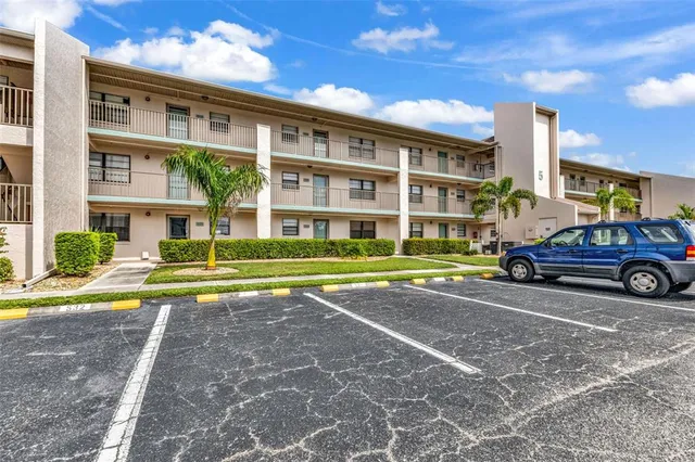 a view of a car park in front of a building