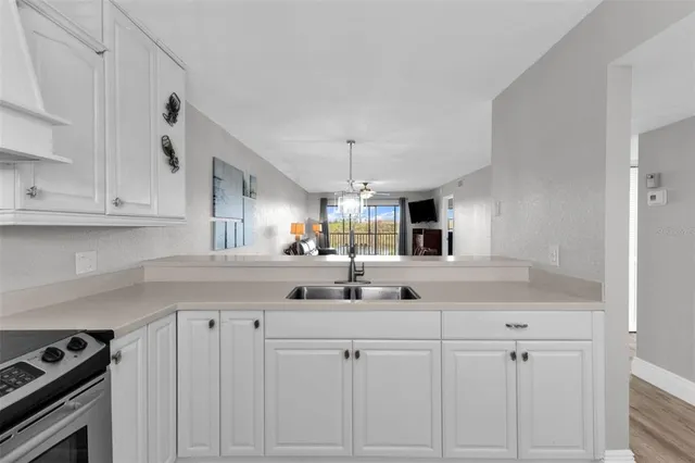 a kitchen with a sink and cabinets