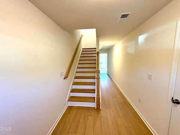 a view of entryway with wooden floor