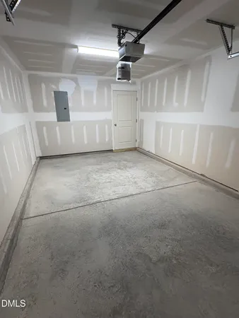 a view of empty room with wooden walls