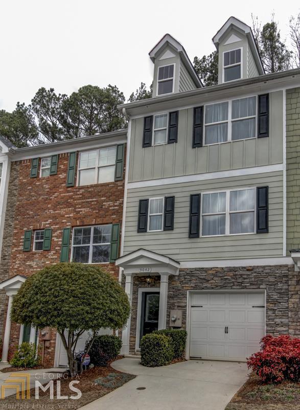 3042 Lauren Parc Road Decatur, GA 30032 - Photo 1 of 1 a front view of a house with a garden