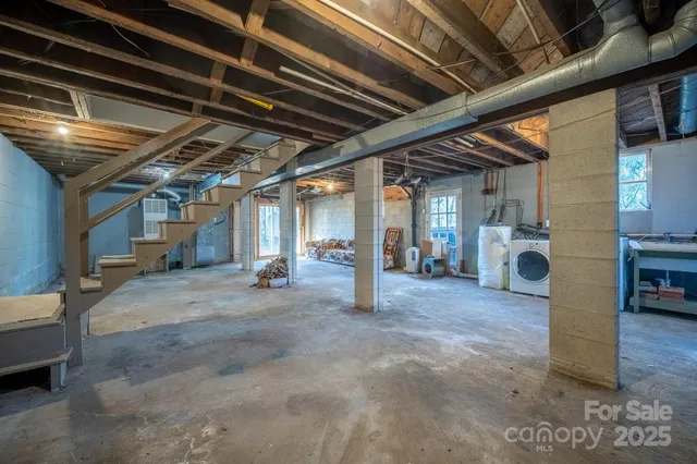 a view of empty room with wooden ceiling