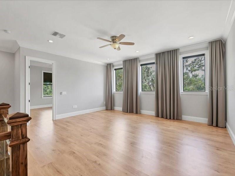 4112 Swift Road Sarasota, FL 34231 - Photo 18 of 41 a view of a livingroom with a chandelier fan and windows