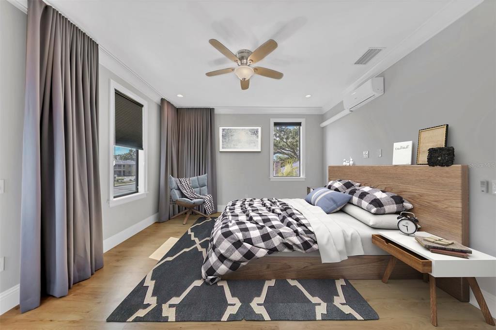 4112 Swift Road Sarasota, FL 34231 - Photo 21 of 41 a bedroom with furniture and windows