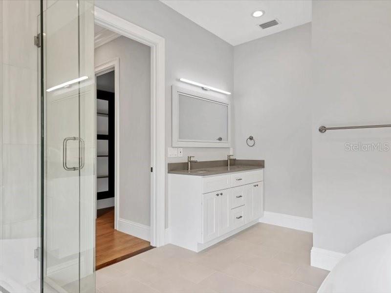 4112 Swift Road Sarasota, FL 34231 - Photo 26 of 41 a bathroom with a granite countertop sink and a mirror