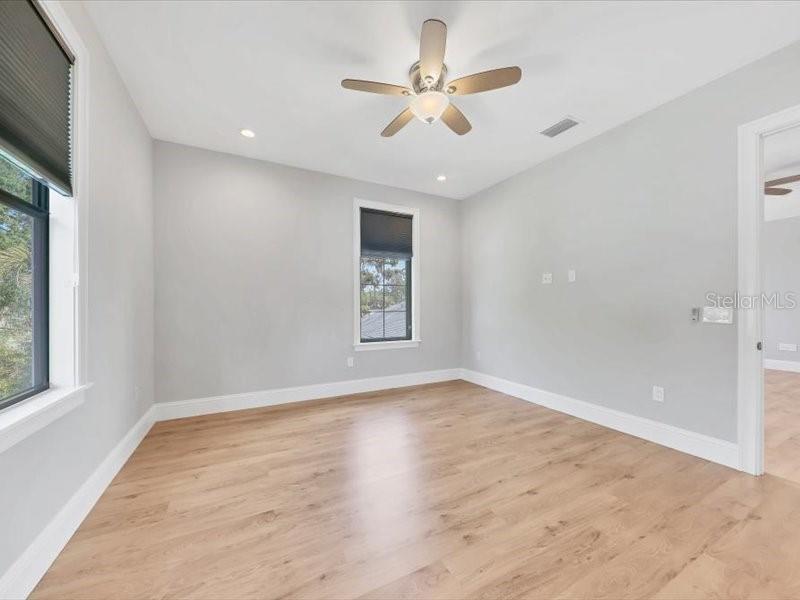 4112 Swift Road Sarasota, FL 34231 - Photo 29 of 41 wooden floor in an empty room with a window