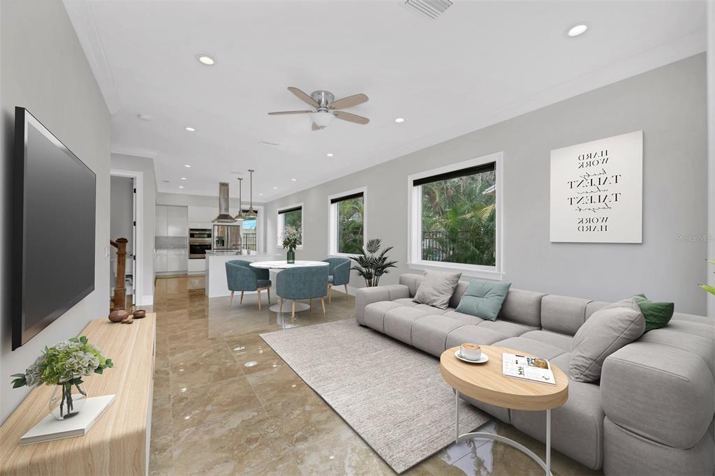 4112 Swift Road Sarasota, FL 34231 - Photo 3 of 41 a living room with furniture and a flat screen tv