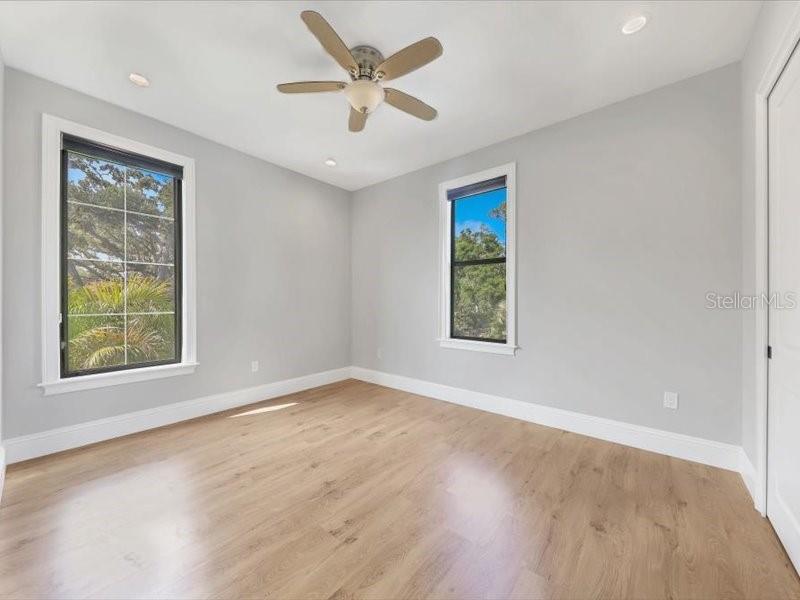 4112 Swift Road Sarasota, FL 34231 - Photo 32 of 41 wooden floor in an empty room with a window