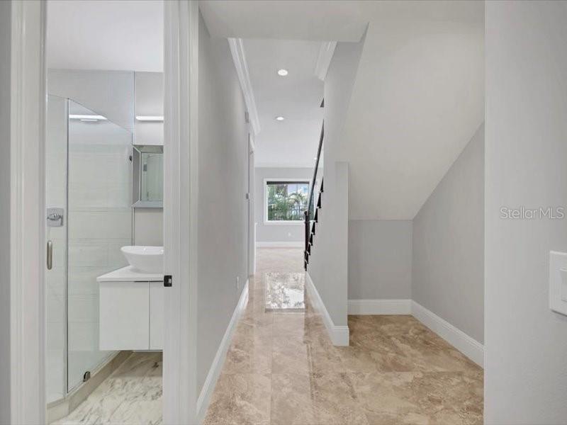 4112 Swift Road Sarasota, FL 34231 - Photo 35 of 41 a view of a hallway view with wooden floor and staircase