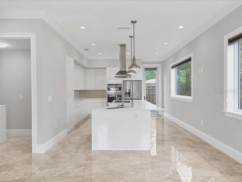 4112 Swift Road Sarasota, FL 34231 - Photo 9 of 41 a view of kitchen with furniture and window