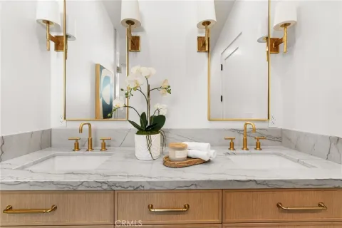 a bathroom with sink and mirror