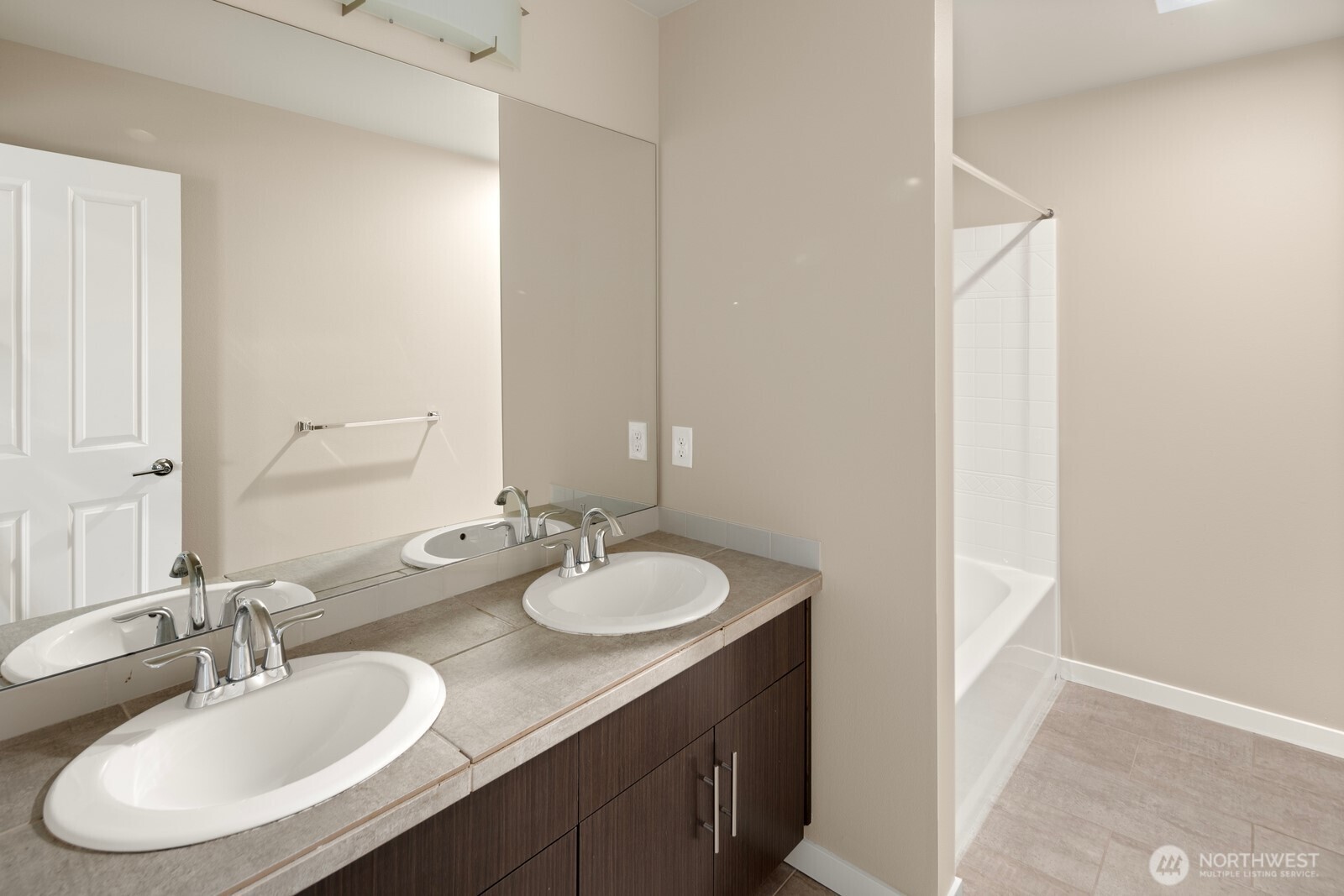 21 175th Place Southeast Bothell, WA 98012 - Photo 24 of 27 a bathroom with a double vanity sink and a mirror