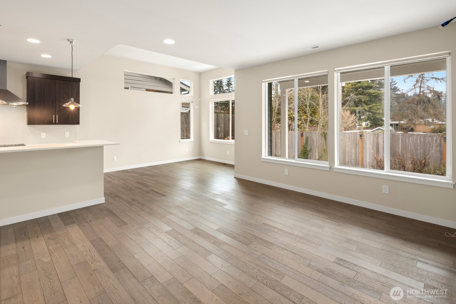 21 175th Place Southeast Bothell, WA 98012 - Photo 4 of 27 a view of a big room with wooden floor and windows