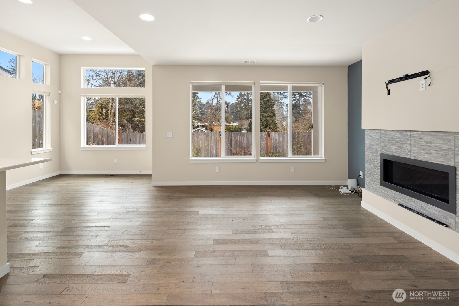 21 175th Place Southeast Bothell, WA 98012 - Photo 5 of 27 an empty room with wooden floor and windows