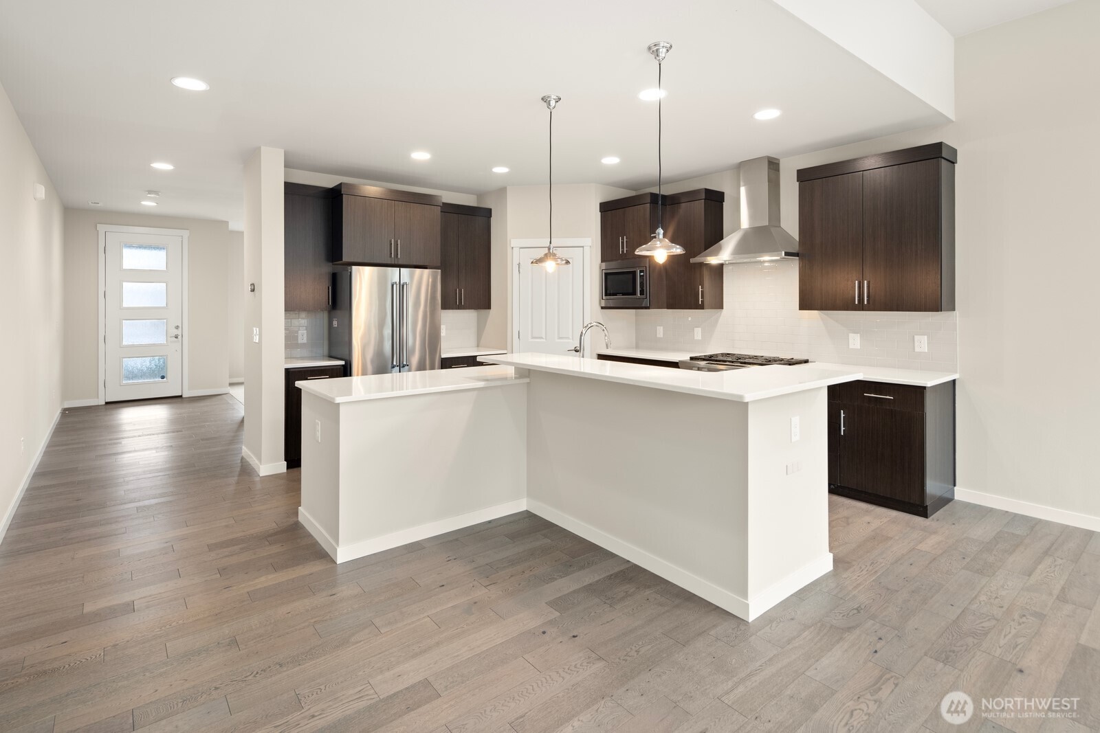 21 175th Place Southeast Bothell, WA 98012 - Photo 6 of 27 a kitchen with kitchen island white cabinets and stainless steel appliances