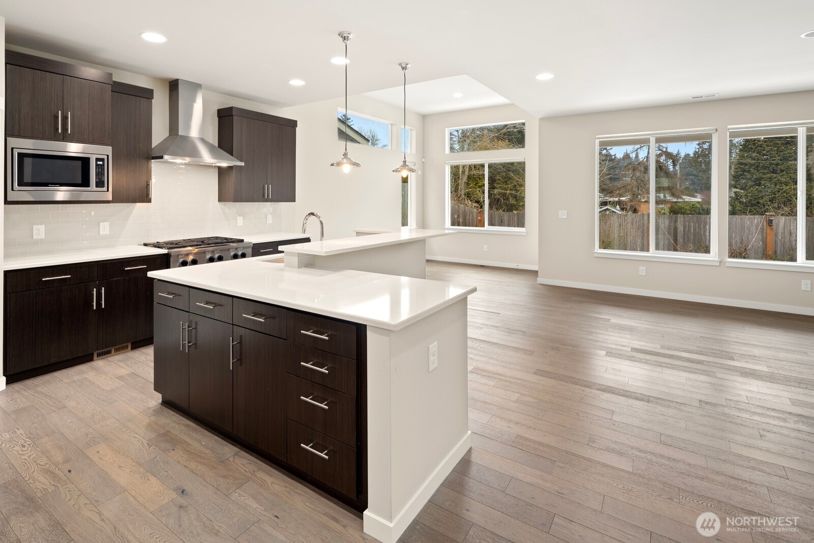 21 175th Place Southeast Bothell, WA 98012 - Photo 8 of 27 a kitchen with a sink a microwave and cabinets