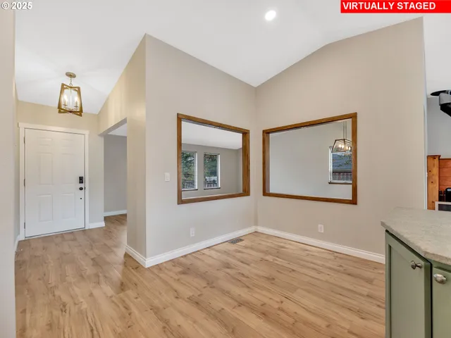a view of livingroom with hardwood floor and hallway