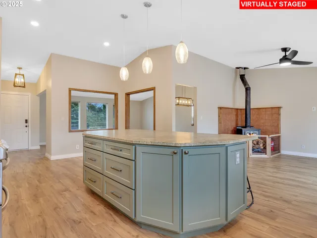 a spacious bathroom with a granite countertop sink a mirror and window
