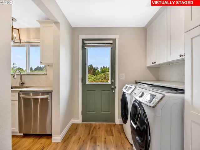 a utility room with closet dryer and washer