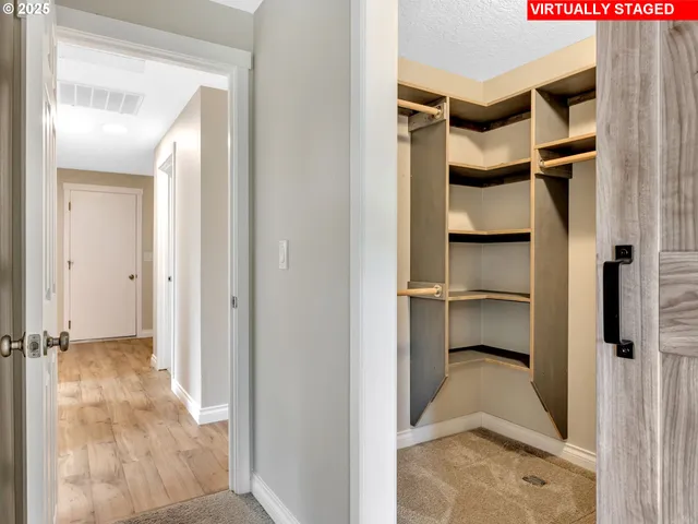 a view of a bedroom with a furniture and closet