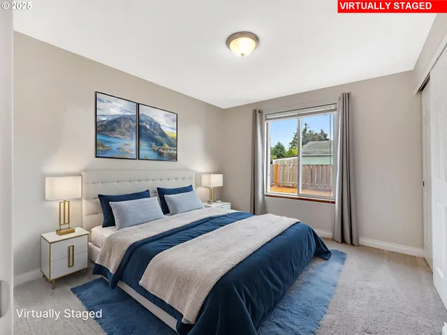 a bedroom with a bed and a night stand