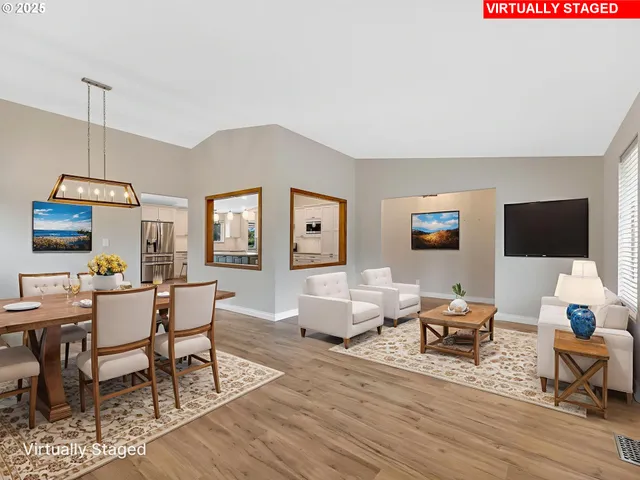 a living room with furniture wooden floor and a flat screen tv