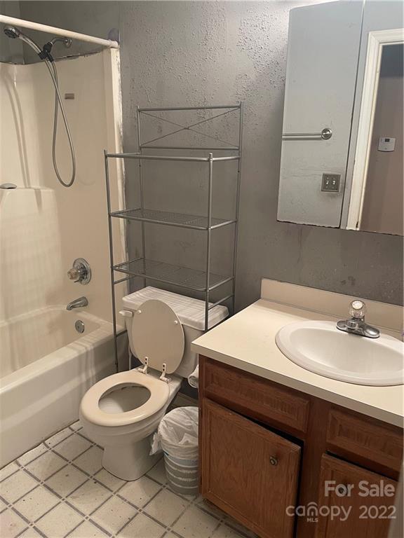 311 Chaney Road Monroe, NC 28110 - Photo 3 of 13 a bathroom with a sink a toilet and a bathtub