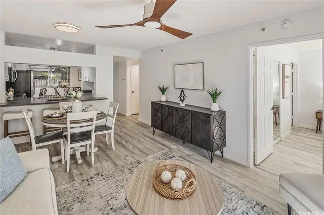 a view of a dining room with furniture and wooden floor