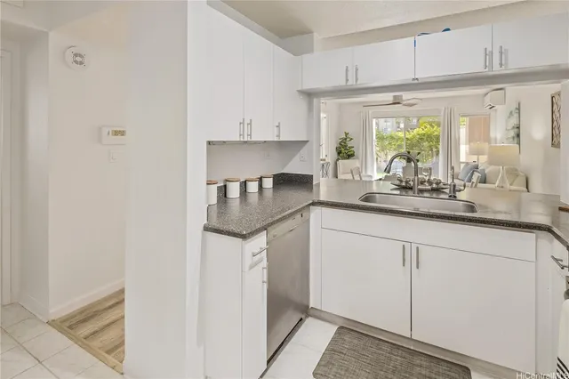a kitchen with stainless steel appliances a sink stove and cabinets