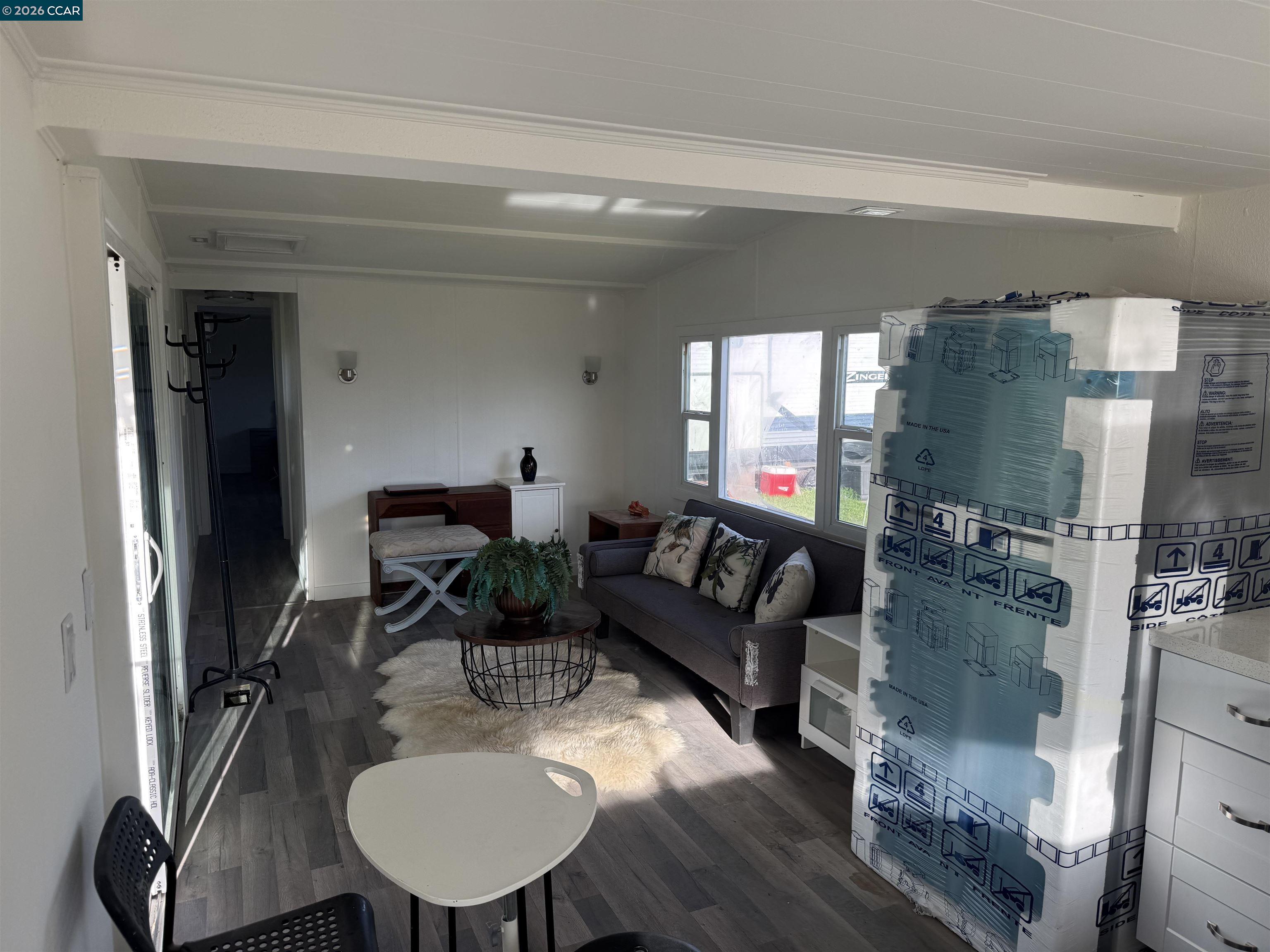 3505 Gateway Road, Unit 13M Bethel Island, CA 94511 - Photo 13 of 17 a living room with furniture and a fireplace